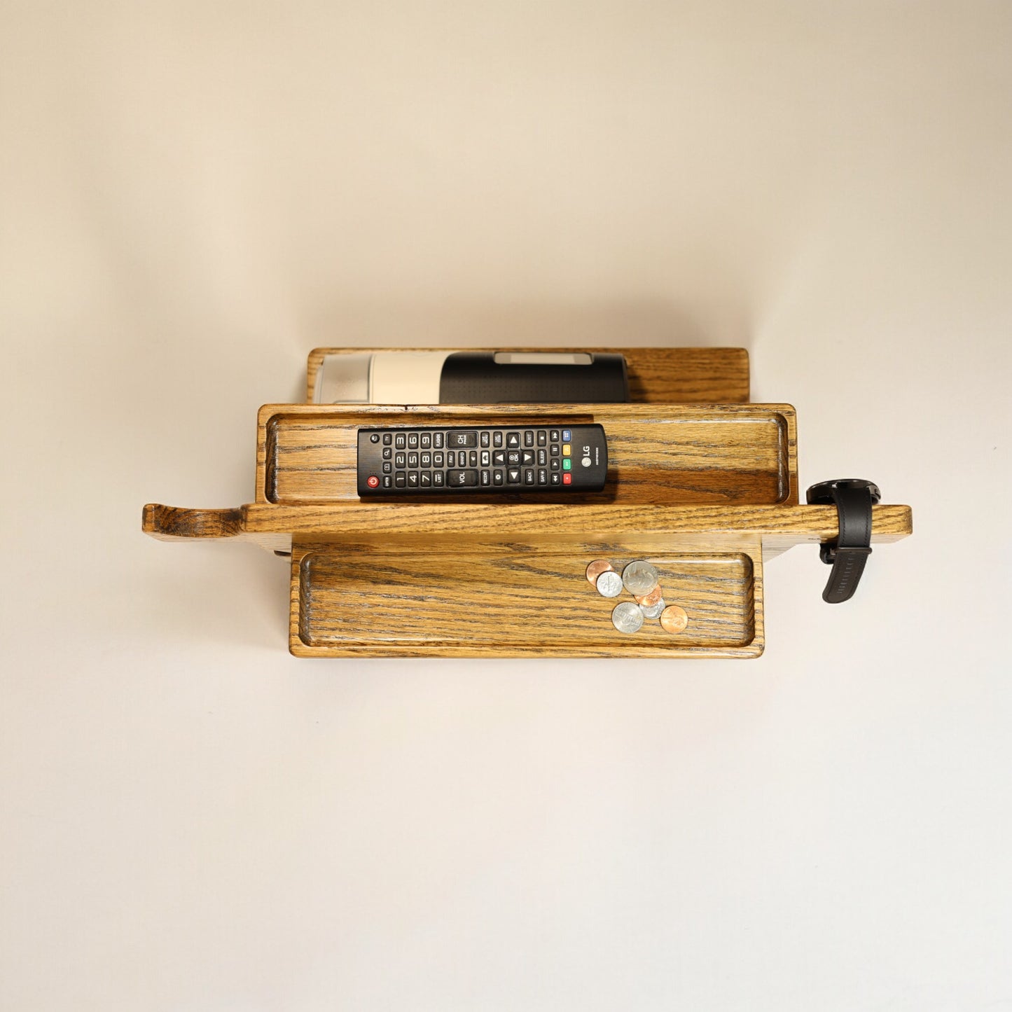 A top view of the CPAP Smart Stand made by Custom Cave Works. The stand is made from solid Oak wood and shows a very organized view of the catch-all trans, including the one on the back side of the stand.